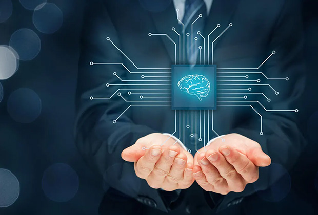 A person in a suit holding a glowing digital brain icon connected to circuit lines.