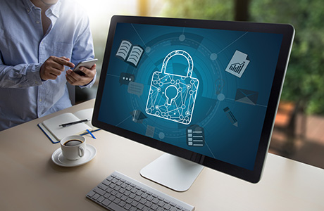 Computer screen on desk with lock symbol